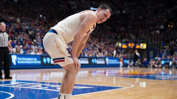 Feb 27, 2024; Lawrence, Kansas, USA; Kansas Jayhawks guard Nicolas Timberlake (25) grimaces after an injury against the Brigham Young Cougars during the first half at Allen Fieldhouse. Mandatory Credit: Denny Medley-USA TODAY Sports  